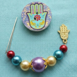 Ohm & Hamsa Needle Minders with Froggers